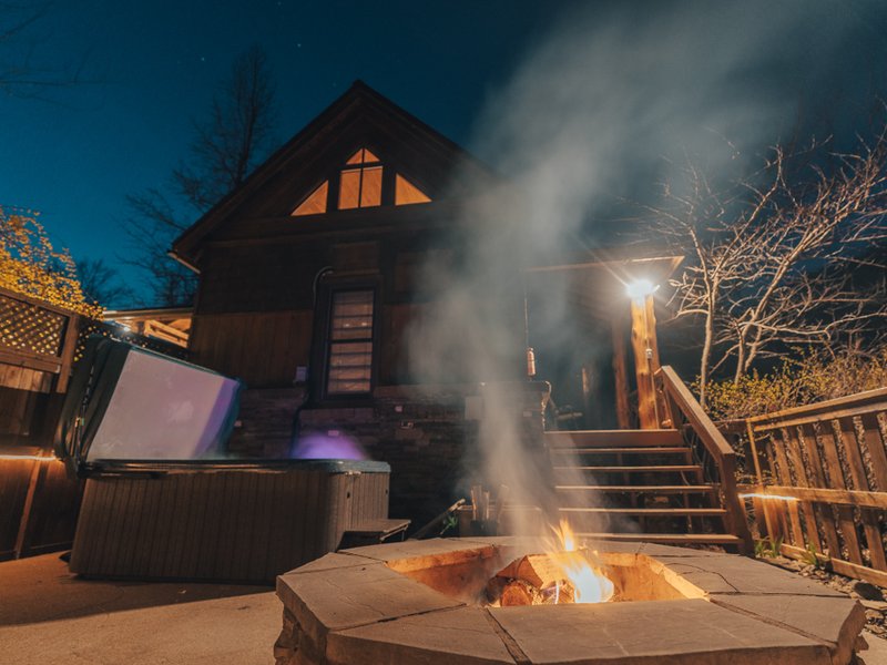 Outside cabin with campfire